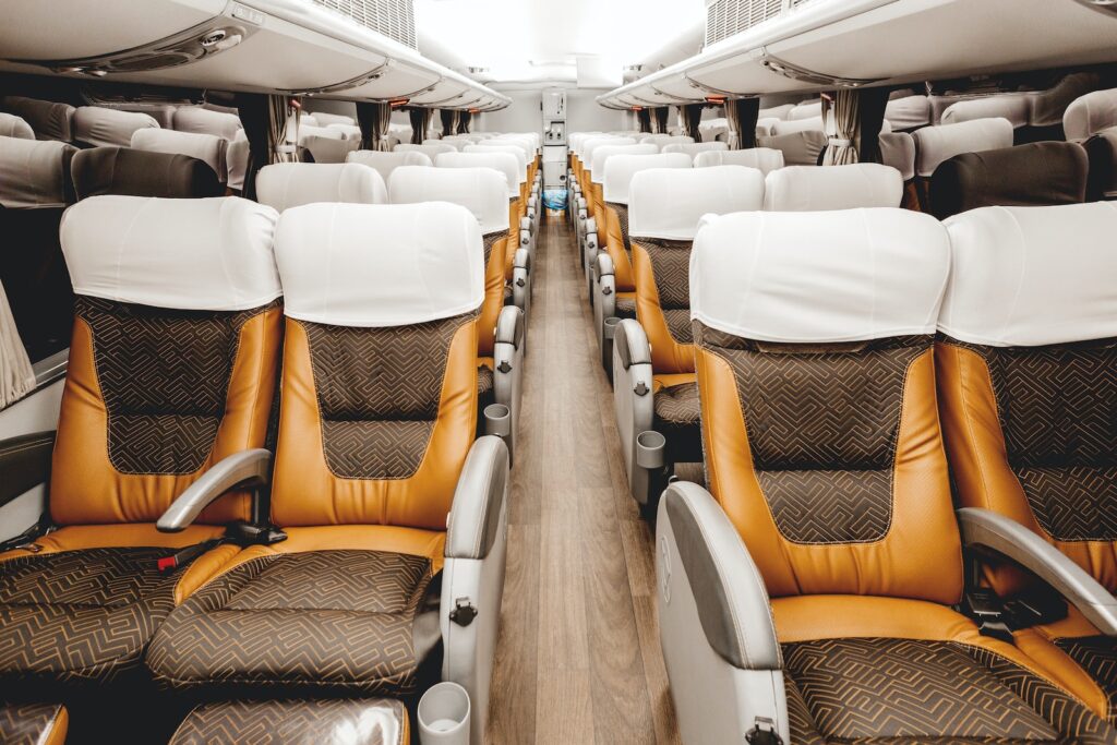 empty brown and white leather airplane seats