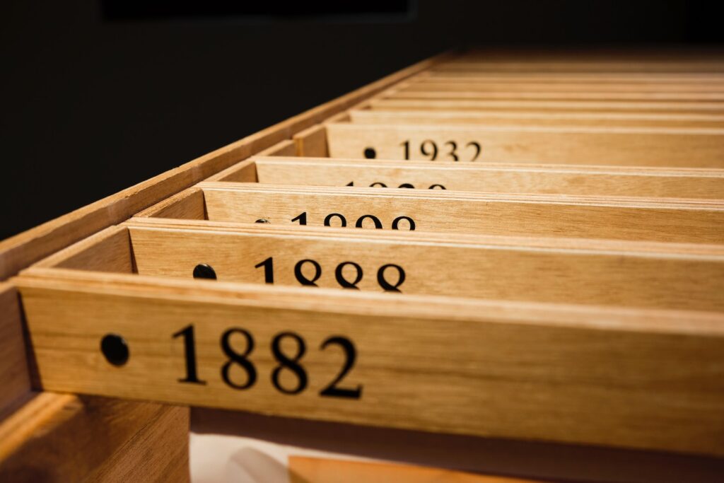 a row of wooden drawers with numbers on them